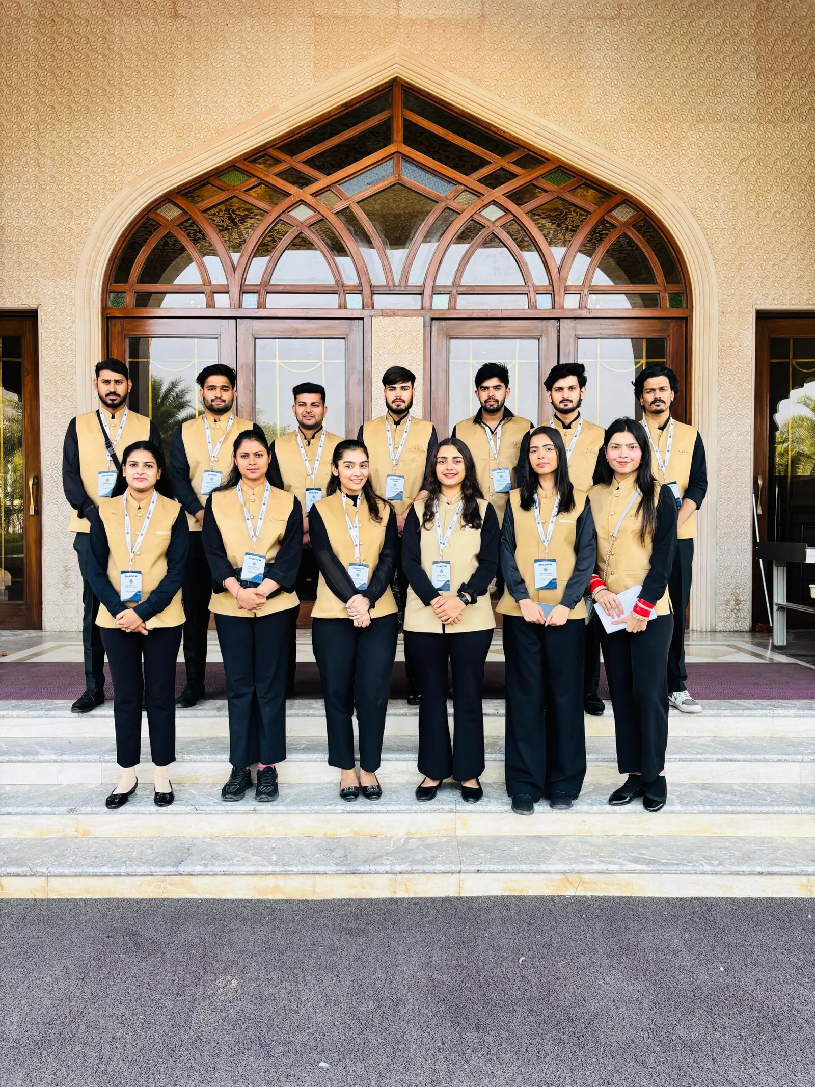 The Show Squad Events team in matching uniforms in front of a venue