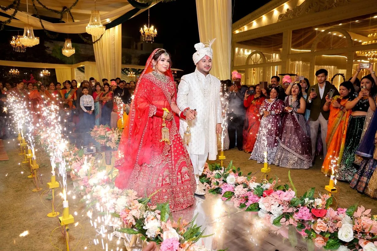 Bride and groom on a decorated wedding stage styled by Show Squad Events