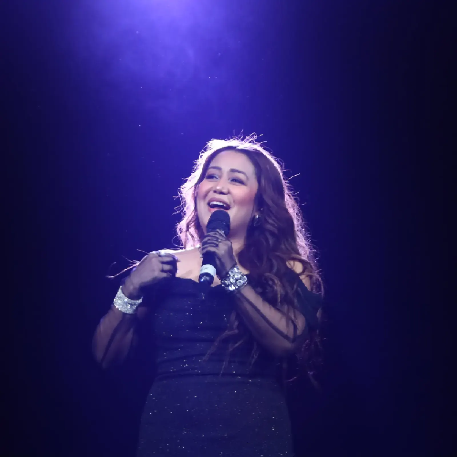 Singer performing live on stage at an event managed by Show Squad Events